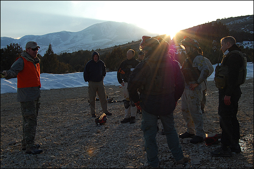 FBI personnel review their actions following a training exercise.