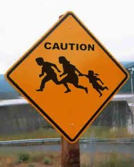 Immigrant Crossing Road Sign